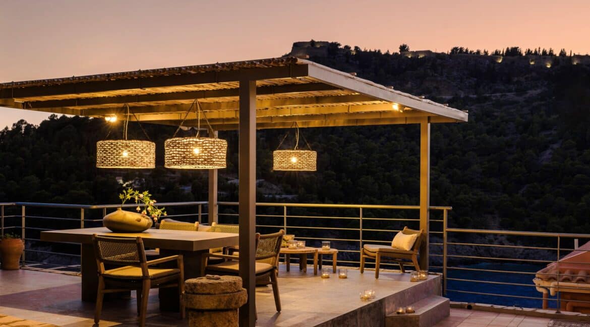 Alfresco pergola and dining area at dusk at Villa Nikolis, Braunis Horio, Assos, Kefalonia.