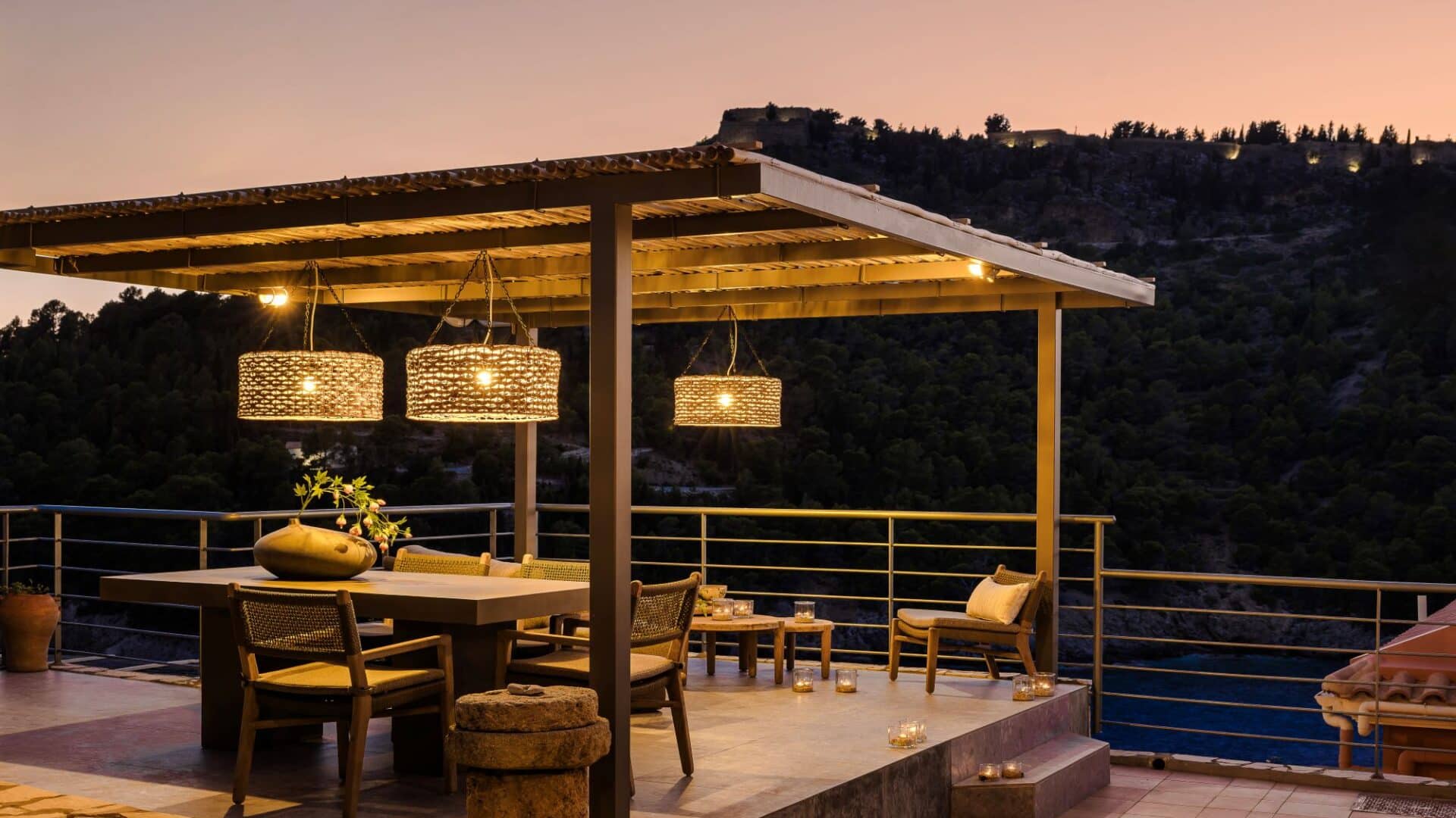 Alfresco pergola and dining area at dusk at Villa Nikolis, Braunis Horio, Assos, Kefalonia.