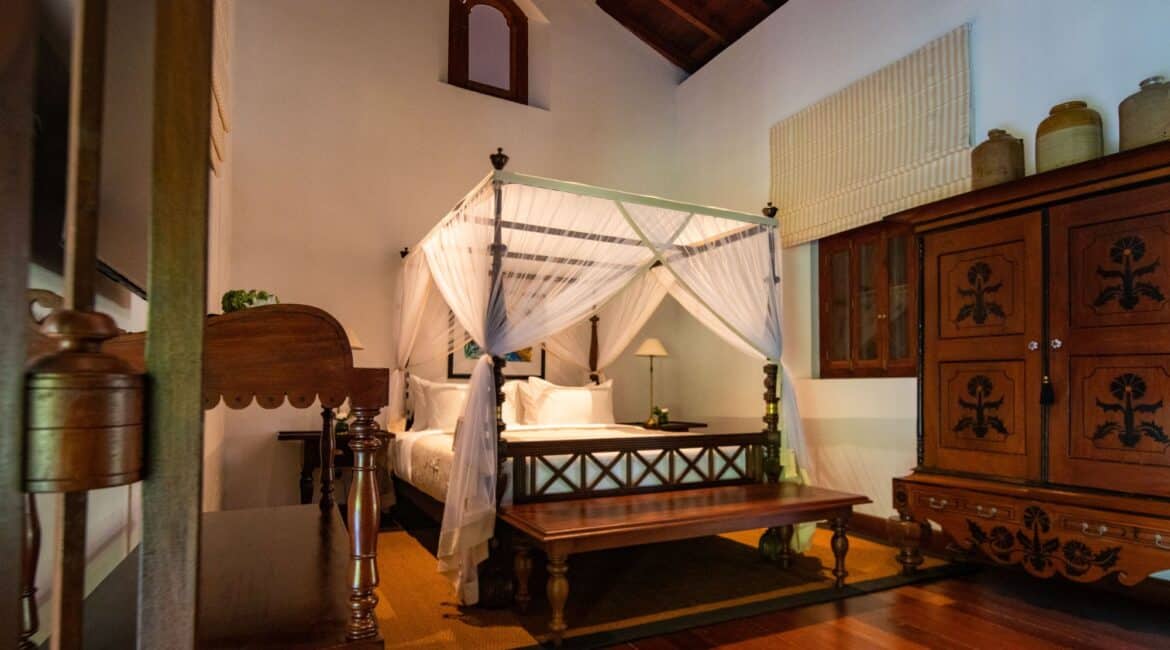 Landesi Galle Fort – upstairs Deluxe Room with four-poster bed and refined interiors