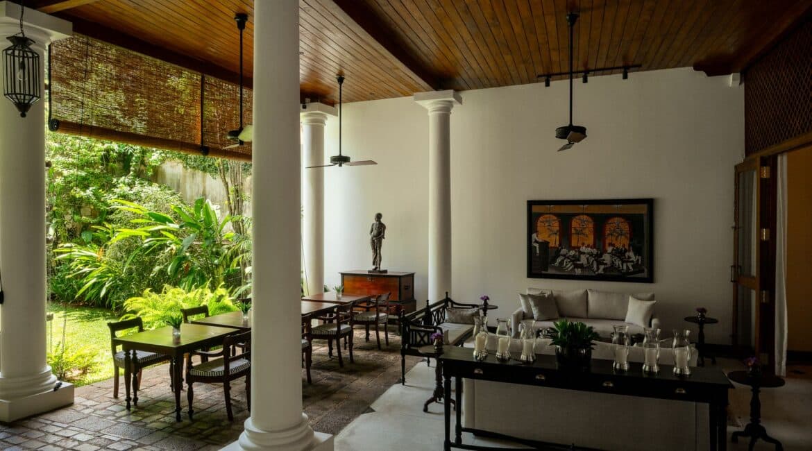 Heritage-style veranda at Landesi Galle Fort, featuring outdoor dining and a comfortable lounge area