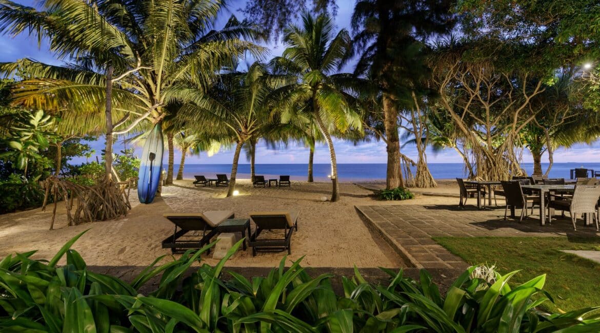 Ocean Suite at Lantern Boutique Hotel Sri Lanka night-time view from the room across the beach with daybeds set beneath the stars
