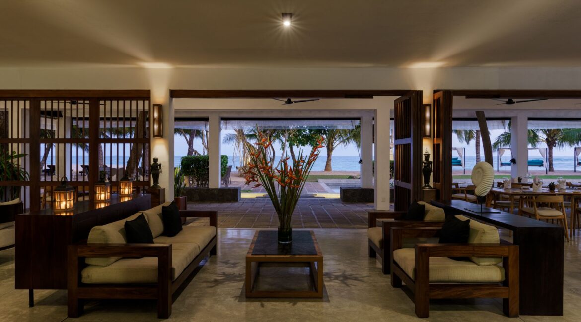 Spacious open-plan living area at Lantern Boutique Hotel, Sri Lanka – blending indoor-outdoor comfort with shaded beachfront views and breezy coastal design