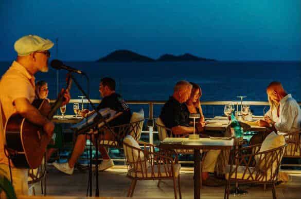 Taraca Bar in Kalkan at dusk, with live music and beautifully crafted cocktails served against a glowing evening backdrop