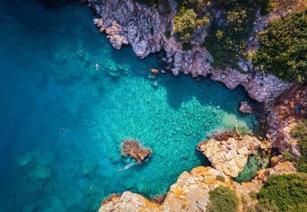 Cakıl Beach near Likya Pavilion in Kalkan — a small, secluded inlet with clear turquoise water and a peaceful setting