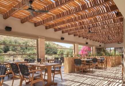 Paralos Irini Mare Agia Galini Crete gorgeous indoor outdoor dining room under the shade of a pergola