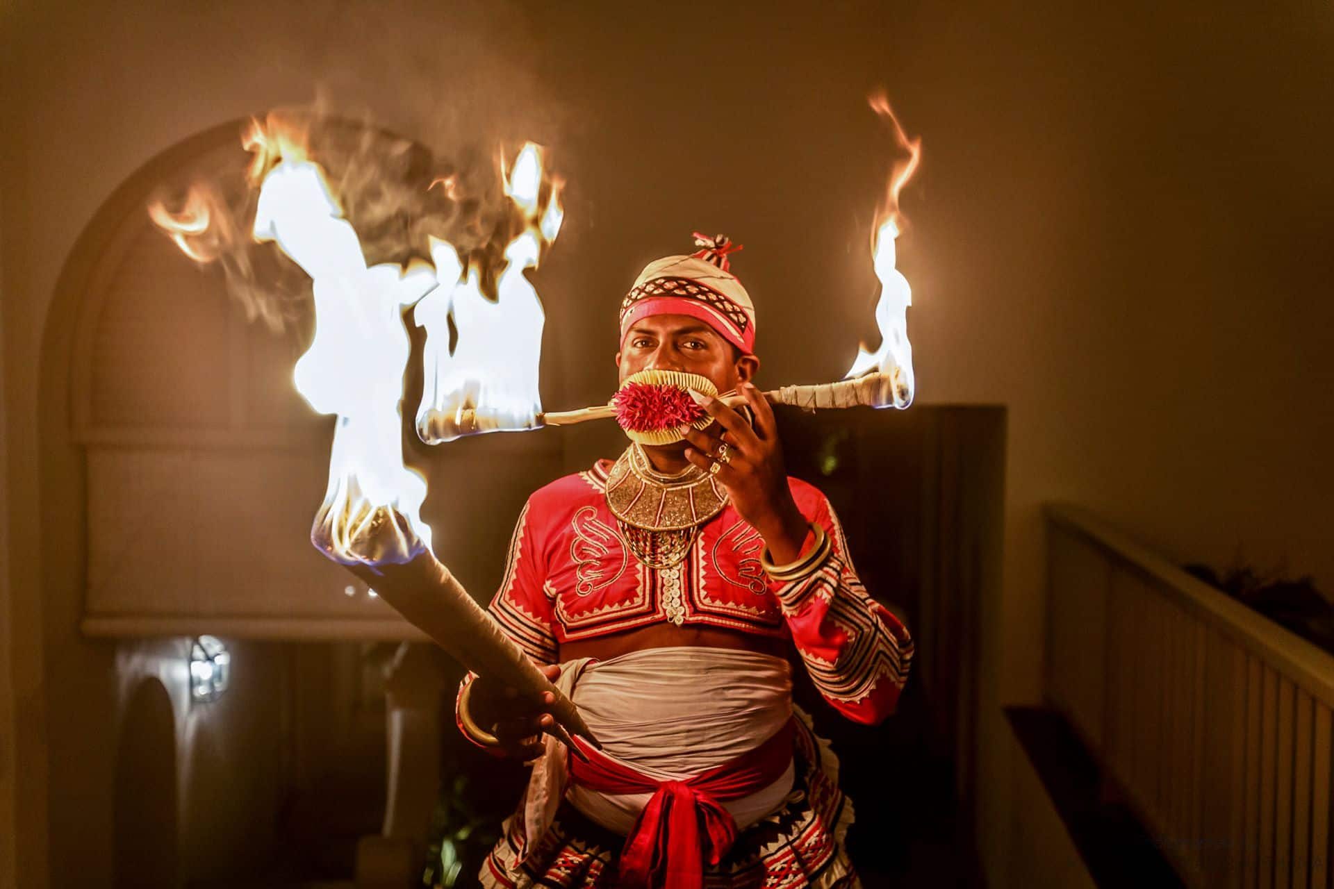 Traditional Sri Lankan fire dancer performing at a local wedding – a vibrant celebration of culture, ritual, and island heritage.